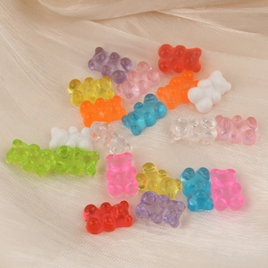 Colorful jelly resin bear charms for DIY craft accessories on beige silk fabric