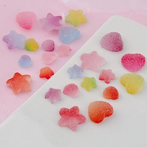 Colorful resin heart and star charms with sugary frosted texture for DIY crafts