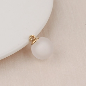 Macro shot of translucent frosted bubble bead with gold metal clasp for DIY jewelry
