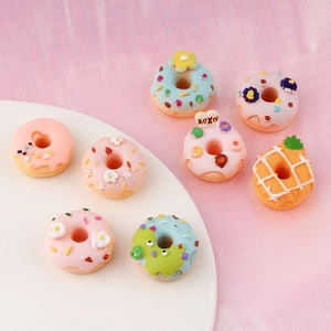 Assorted resin donut and pineapple charms for DIY phone case crafts and accessories