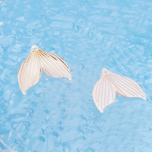Elegant ivory acrylic mermaid tail charms with gold striped accents for DIY jewelry making