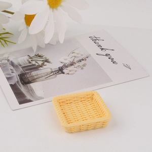 Detailed view of yellow resin mini woven tray model for DIY cream glue phone case crafts