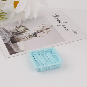 Macro detail of a light blue square woven resin mini tray for DIY accessory storage