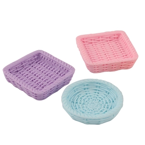 Miniature woven resin baskets in pink, purple, and blue for DIY phone case crafts