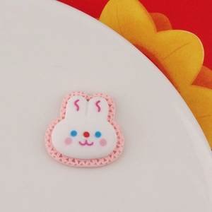 Macro detail of cartoon resin rabbit charm for DIY craft and phone case decoration