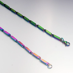 Detailed macro view of iridescent rainbow stainless steel chain with lobster clasp