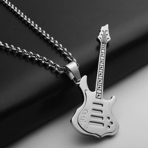 Macro shot of silver guitar pendant showing intricate metal details and sturdy chain link
