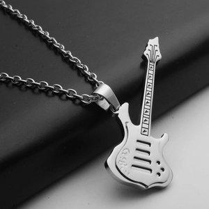 Macro shot of polished silver electric guitar pendant with detailed fretboard and strings
