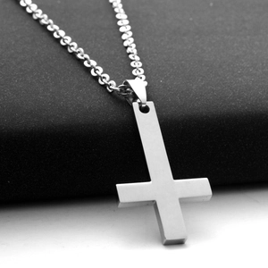 Minimalist silver stainless steel inverted cross pendant necklace with a matte finish