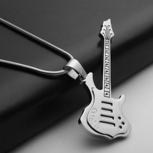 Close-up of a stainless steel guitar pendant with GB engraving on black leather
