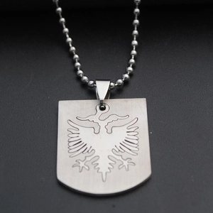Brushed stainless steel shield pendant necklace featuring an engraved double-headed eagle