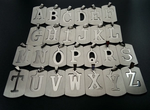 Detailed set of twenty-six stainless steel alphabet pendant charms in silver finish