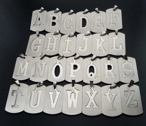 Collection of silver stainless steel dog tag pendants with A-Z hollow letter cutouts