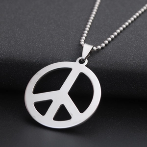 Detailed view of polished stainless steel peace sign pendant with classic ball chain necklace