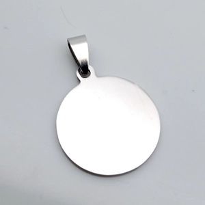 Close-up of polished round stainless steel military tag pendant with mirror finish surface