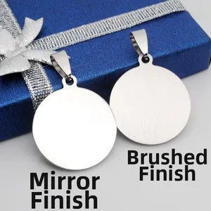 Detail of round stainless steel pendant showing mirror and brushed metal finish options