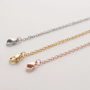 Detailed view of stainless steel O-chains in silver, gold, and rose gold with lobster clasps