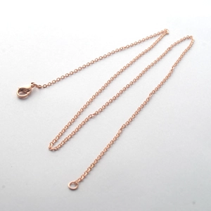 Detail of rose gold stainless steel cross chain with a lobster clasp for women necklaces