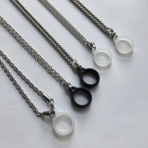 Macro shot of silver stainless steel necklaces with silicone rings for vape and accessories
