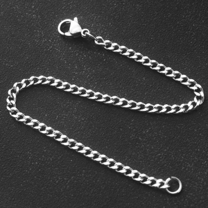Polished 304 stainless steel curb chain bracelet with lobster clasp on black background