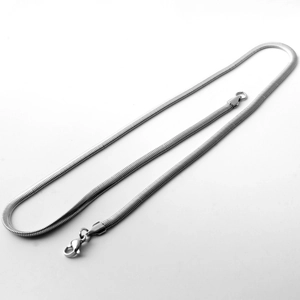 Close-up of a silver snake chain necklace with a secure lobster clasp closure