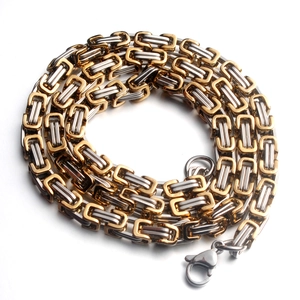 Detail of bicolored titanium steel Byzantine chain bracelet with a secure lobster clasp