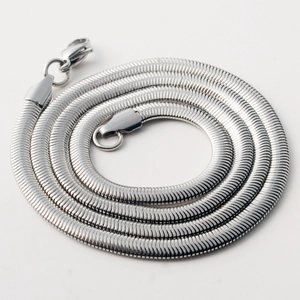 Close-up of polished silver flat snake chain necklace with secure lobster clasp detail