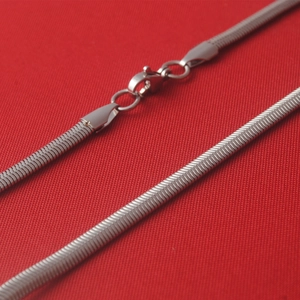 Flat snake bone chain necklace in silver stainless steel with lobster clasp closure
