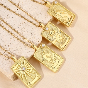 Vintage gold tarot card pendant necklace set with embossed patterns and cubic zirconia