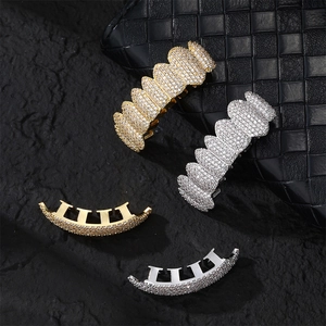 Iced out hip hop grillz set in gold and silver finish with sparkling zircon stones