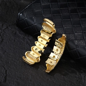 Hiphop gold plated star cutout dental grillz set on professional jewelry display