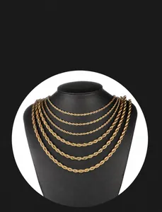 Detail of layered gold vacuum plated stainless steel rope chain necklaces on a bust