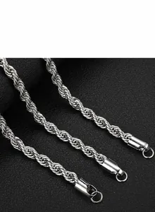 Close-up of a silver stainless steel rope chain with polished cylindrical metal end caps