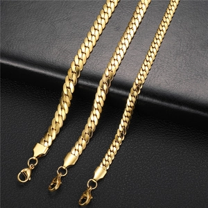 Detailed view of three gold-plated stainless steel Cuban link chains with lobster clasps