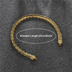 Detail view of 20cm gold stainless steel flat embossed cuban chain bracelet on stone