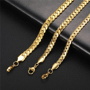 Detailed macro of flat gold-plated Cuban chains with lobster clasps in three widths