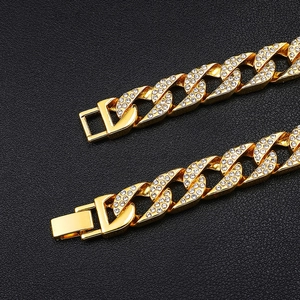 Detailed macro view of 18k gold plated Cuban chain with iced out micro pave zircons