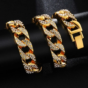 Macro shot of gold-plated hip-hop Cuban link bracelet with iced-out pave diamonds