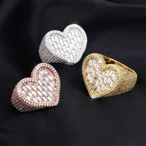 Hip hop heart rings in gold, silver and rose gold with baguette cut diamonds