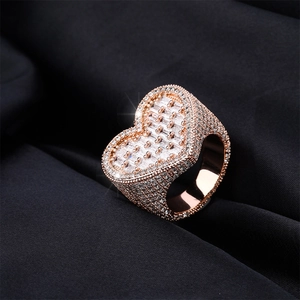 Hip hop heart ring in rose gold with iced out pavé diamonds and baguette cut stones