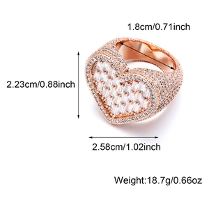Macro view of iced out heart ring in rose gold showing hip-hop style dimensions