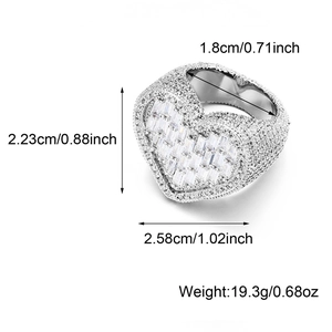 Detailed view of iced out heart ring with silver plating and cubic zirconia dimensions