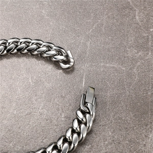 Detailed close-up of polished stainless steel Cuban chain link and clasp mechanism