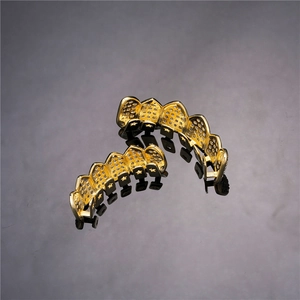 Hip hop gold plated grillz set with pavé cubic zirconia and star cutout details