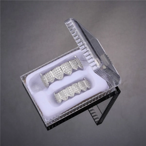 Close-up of hip hop silver grillz set with cubic zirconia stones in clear display box