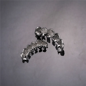Macro shot of silver hip hop grillz set with shiny micro pave cubic zirconia