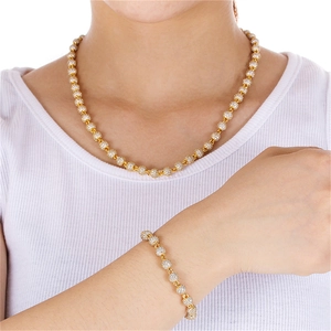 Detail van vergulde 6mm kogelketting ketting en armband set met witte zirkoon steentjes