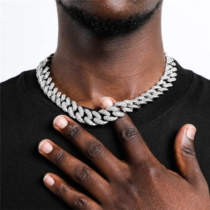 Close-up of hip hop iced out Cuban link chain with sparkling white zircon stones