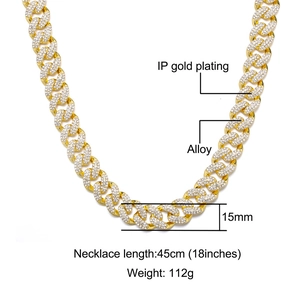 Detail showing 15mm gold Cuban link chain with white zircons and IP gold plating