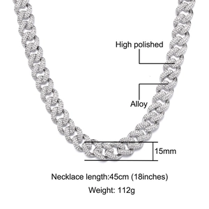 Detailed view of 15mm Cuban link chain with high polished finish and pave zircon stones